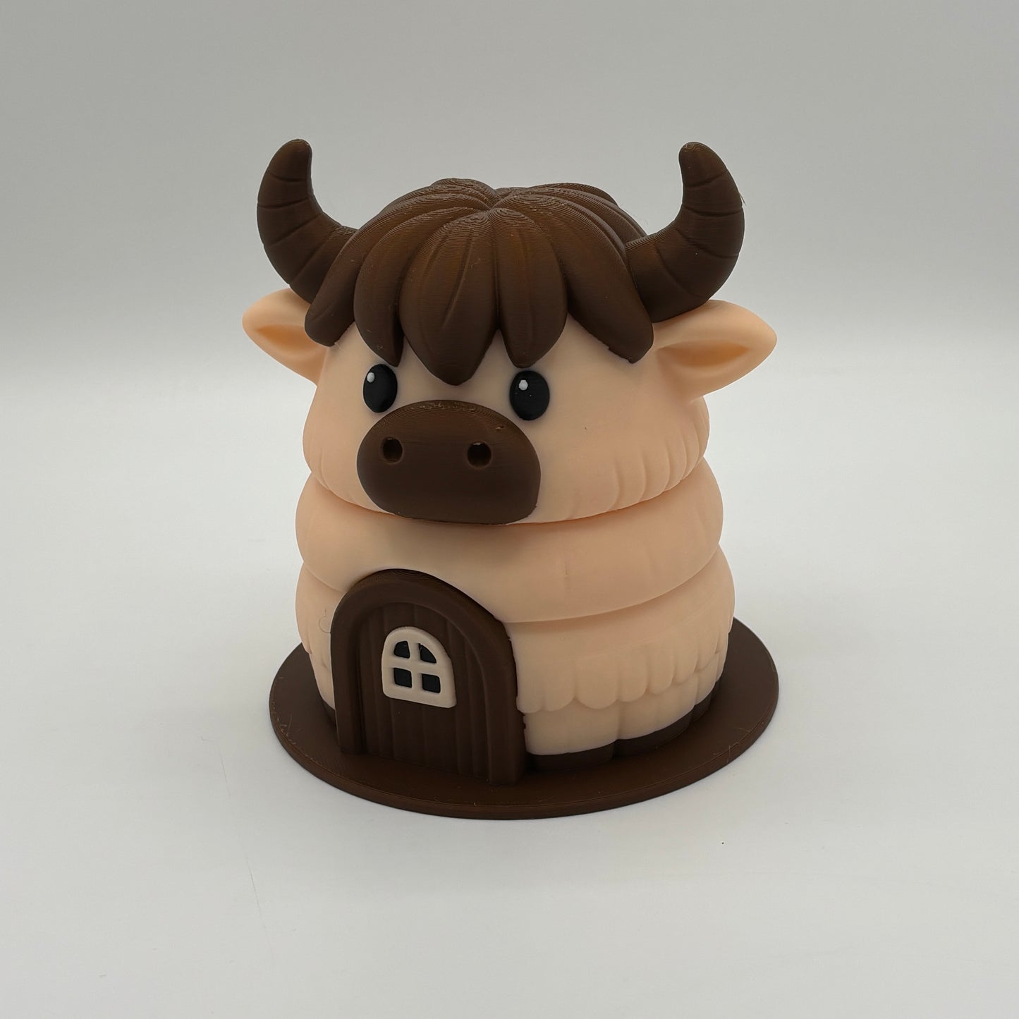 Kuh-Haus mit vier niedlichen Kühen