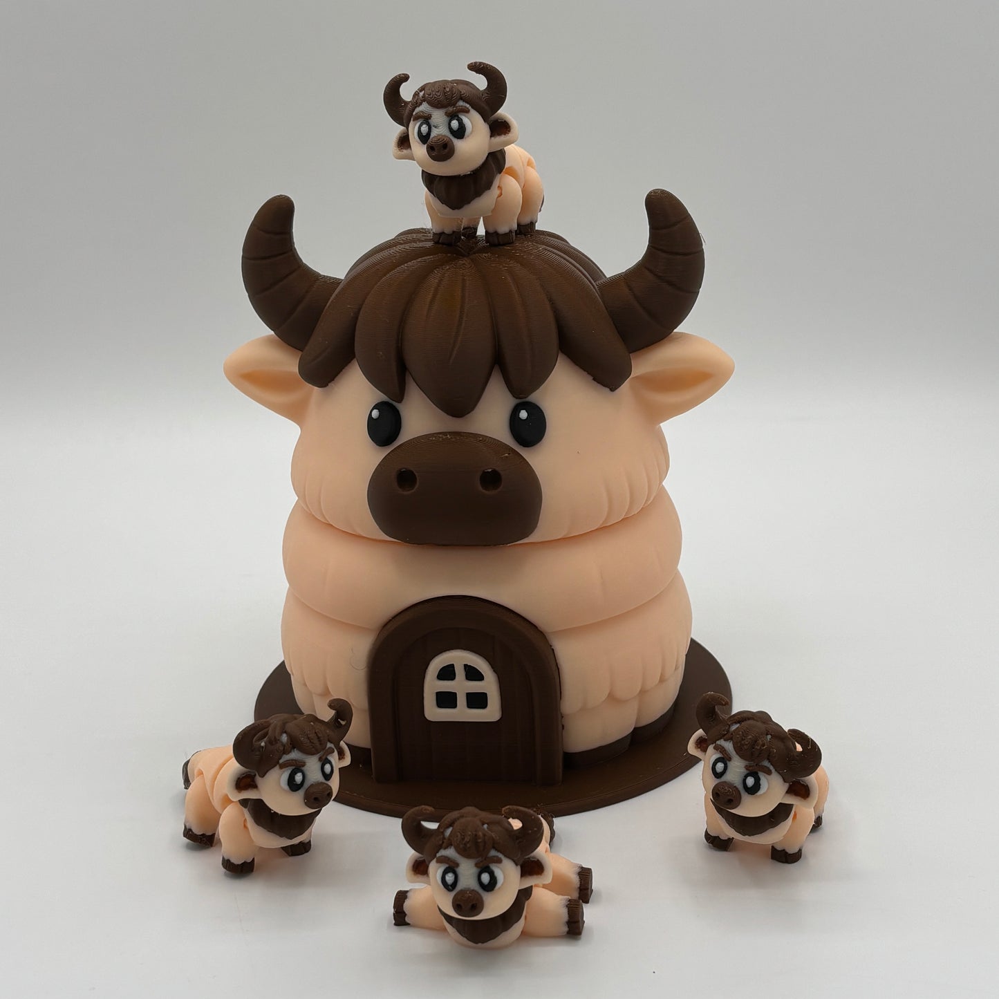 Kuh-Haus mit vier niedlichen Kühen